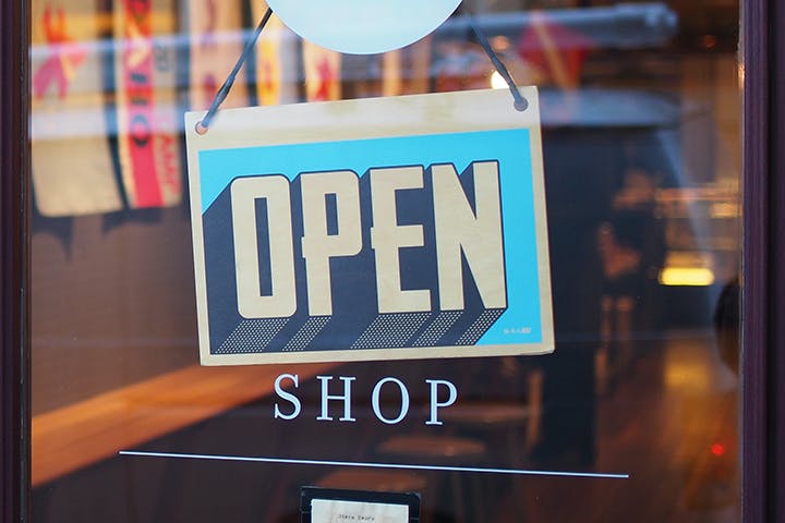 Shop door with 'Open' sign